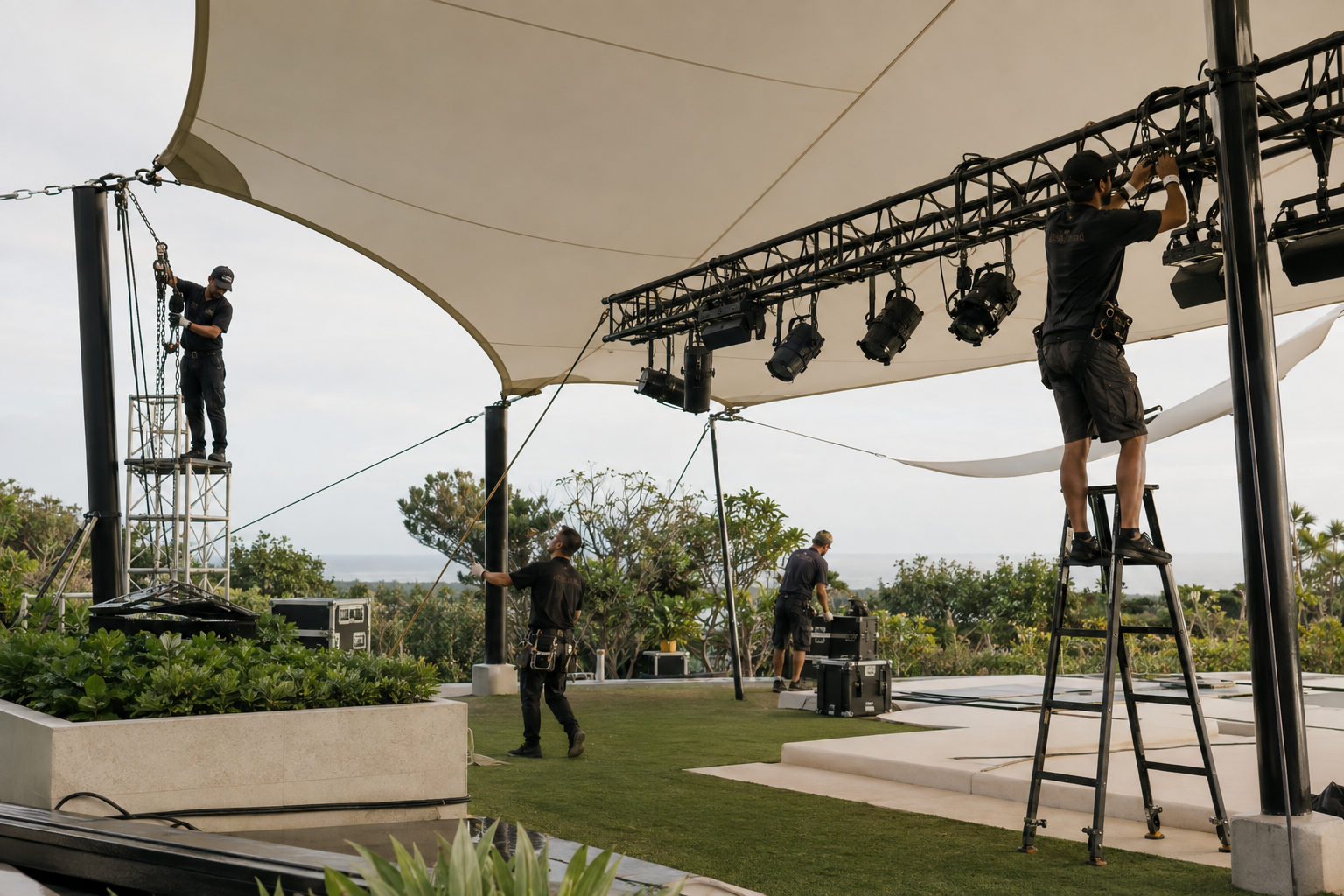 Concept of an event production crew installing a contemporary canopy and lighting